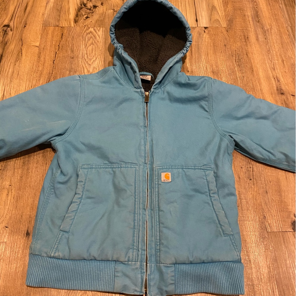 Used Carhartt jacket,Sherpa lined. Girls medium size 10-12.Great outdoor jacket.